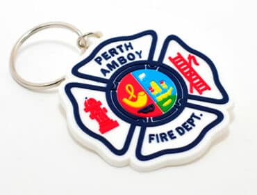 Soft PVC custom shaped keychain for a fire department with 3D layered details