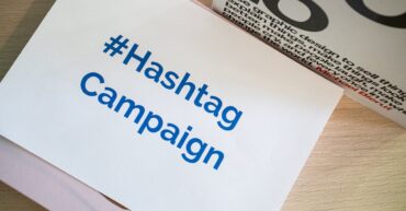A concept image of a hashtag campaign displayed on paper for marketing strategies.